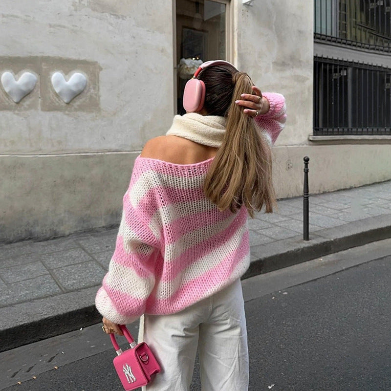 Person wearing a pink and white striped sweater and pink headphones, walking on a street, 
Mordenstore. 