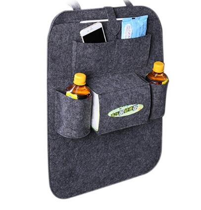 Gray car seat organizer with multiple pockets holding a phone, bottle, and other items on a white background, mordenstore. 