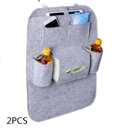 Gray car organizer with multiple pockets holding drinks and a phone on a white background, mordenstore. 