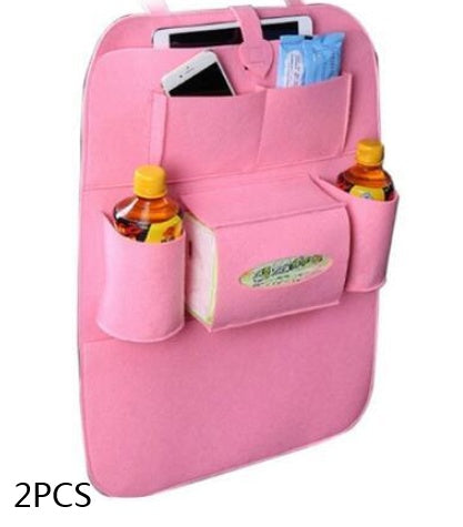 Pink car organizer with multiple pockets holding drinks and a phone on a white background, mordenstore. 