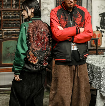 Two people wearing embroidered jackets in a traditional setting