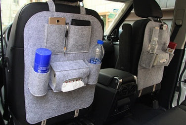 Car seat organizer with multiple pockets and items in a vehicle, mordenstore. 