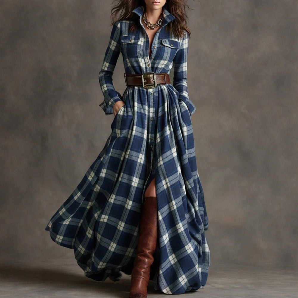 Woman wearing a long blue plaid dress with brown boots against a gray background