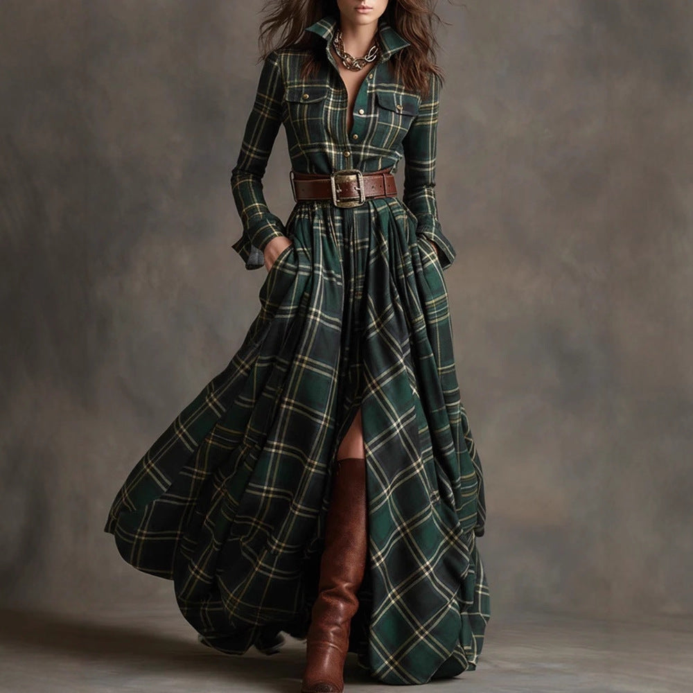 Woman wearing a long green plaid coat with a belt and brown boots on a gray background